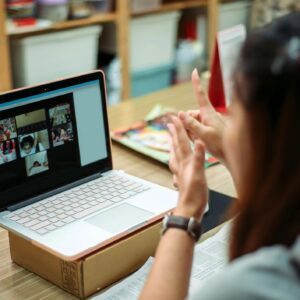 Asian chinese female teacher teaching online art class at art school
