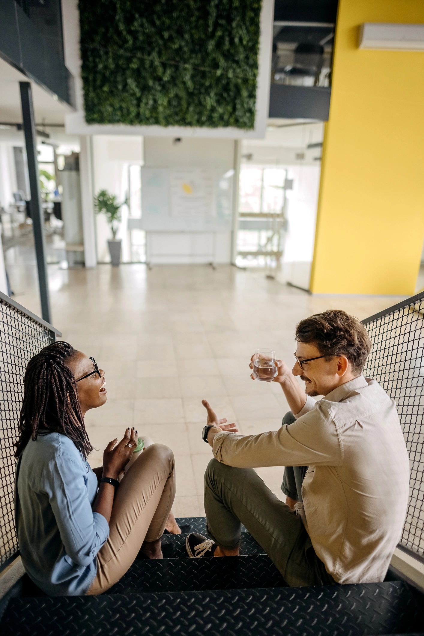 Black professionals in a supportive mentorship conversation at work