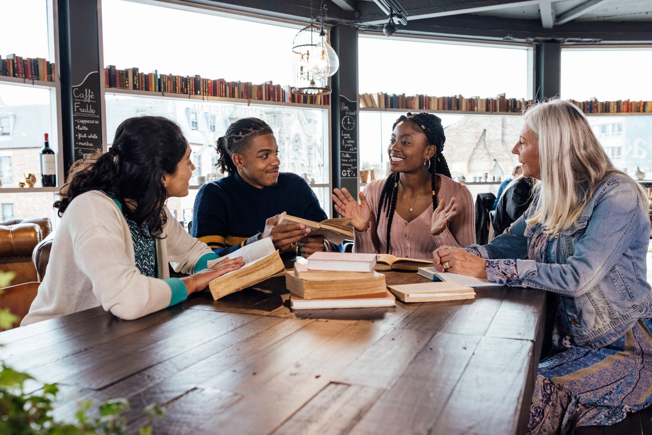 Adults in a faith-based study group discussing a book together