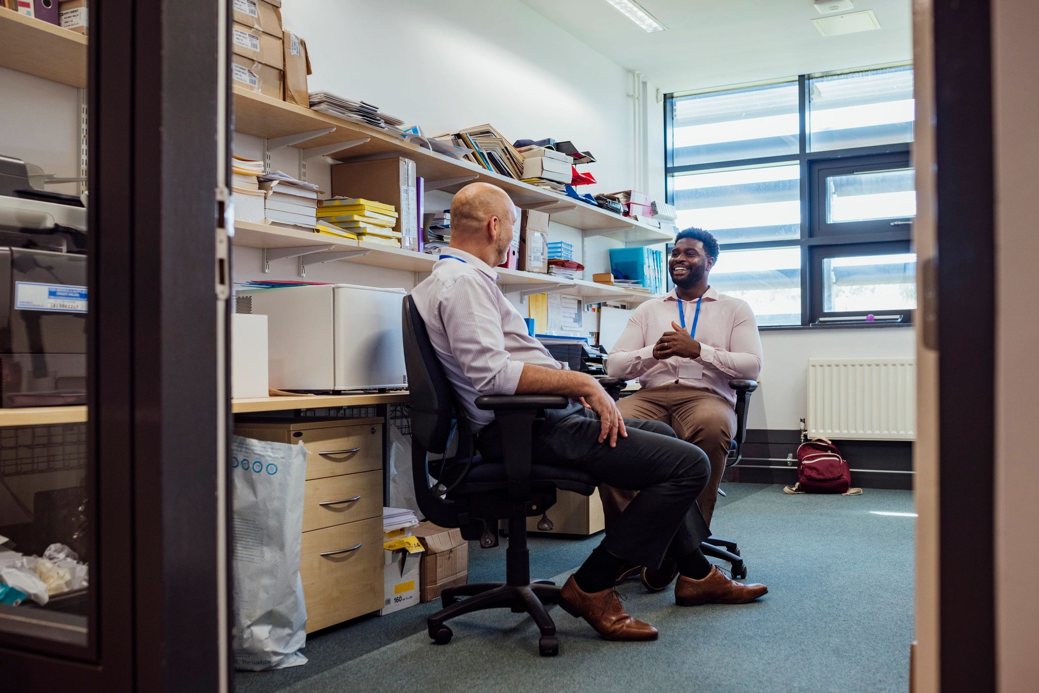 Professional mentoring discussion in an office