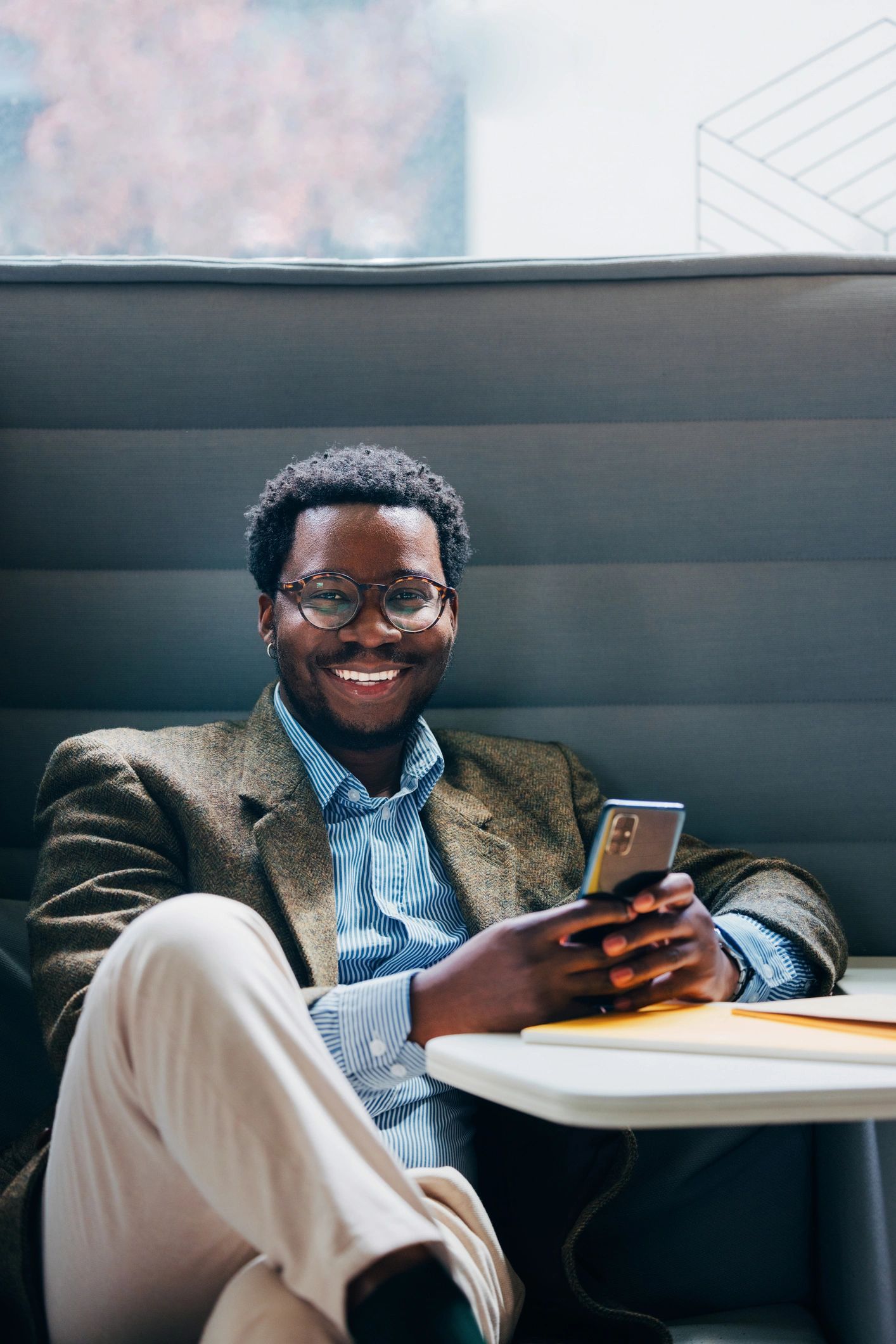 Portrait of a confident professional smiling in an office
