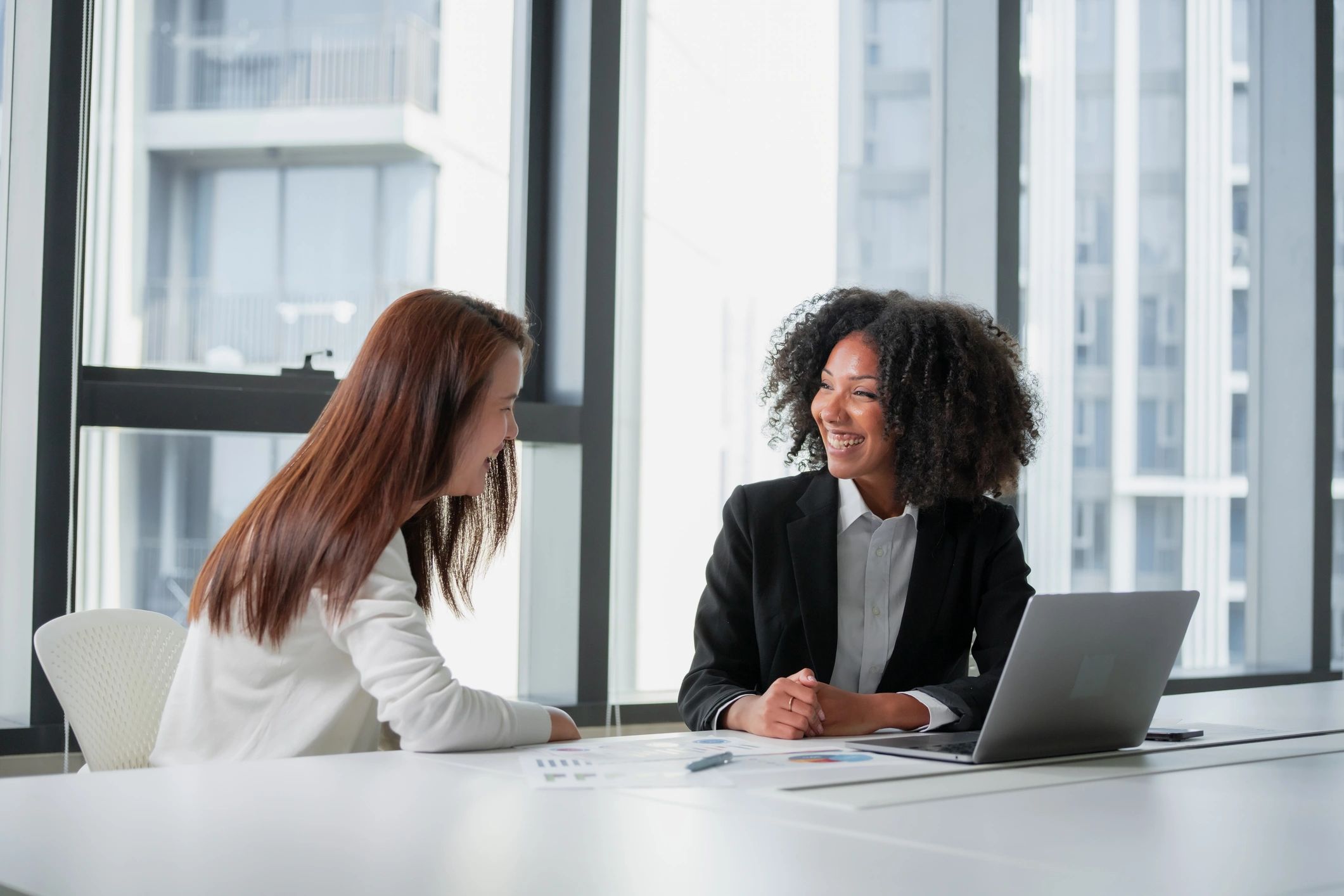 Mentor and client meeting in a modern office